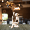 Sitting figurine vase holder – white minimalist human sculpture holding transparent bud vase with dried flowers